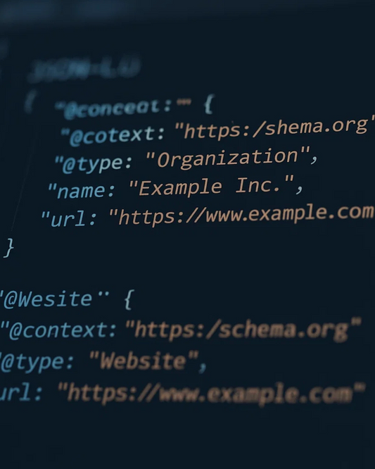 ALT (EN): JSON-LD Organization and Website schema in a code editor — Vista by Lara ALT (AR): مخطط JSON-LD لجهة Organization وWebsite في محرر كود — Vista by Lara